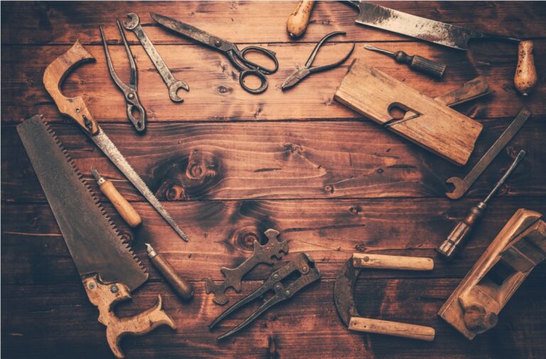 assortment of old and rusty tools in workshop in vintage look