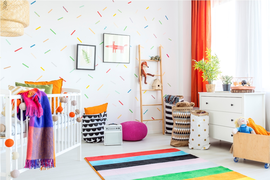 cozy modern baby room decor with white floor and colorful additions