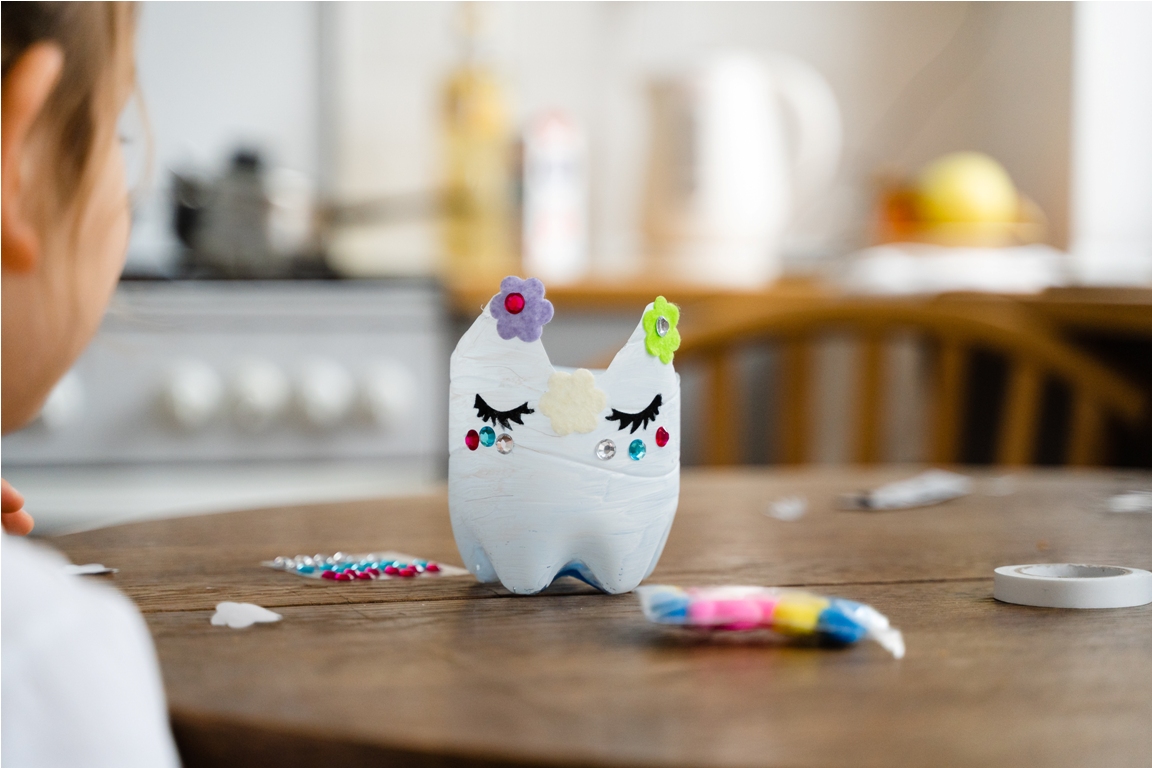caucasian preschool girl doing crafts with plastic 2023 08 30 02 43 21 utc
