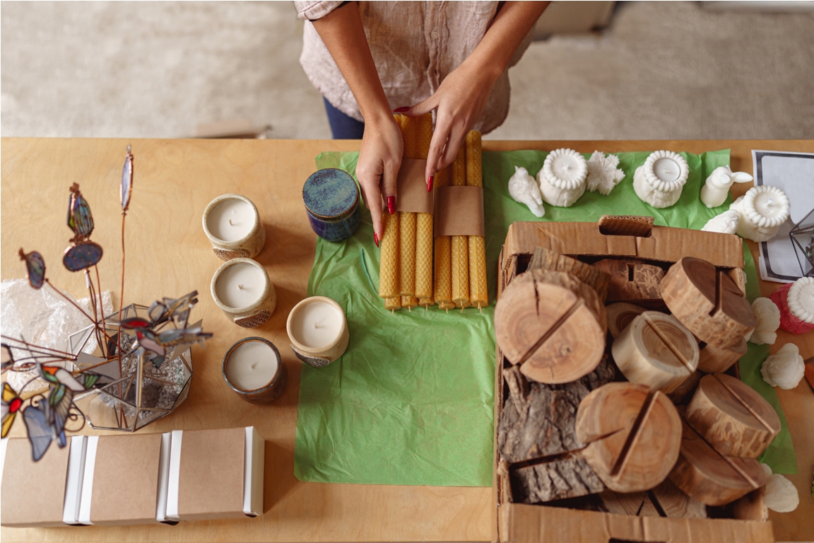 close up of woman is packing handmade candles for 2023 03 17 23 28 53 utc