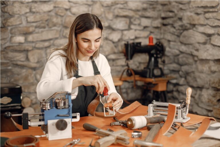 female leather craftsman working on a belt 2022 08 06 21 48 06 utc
