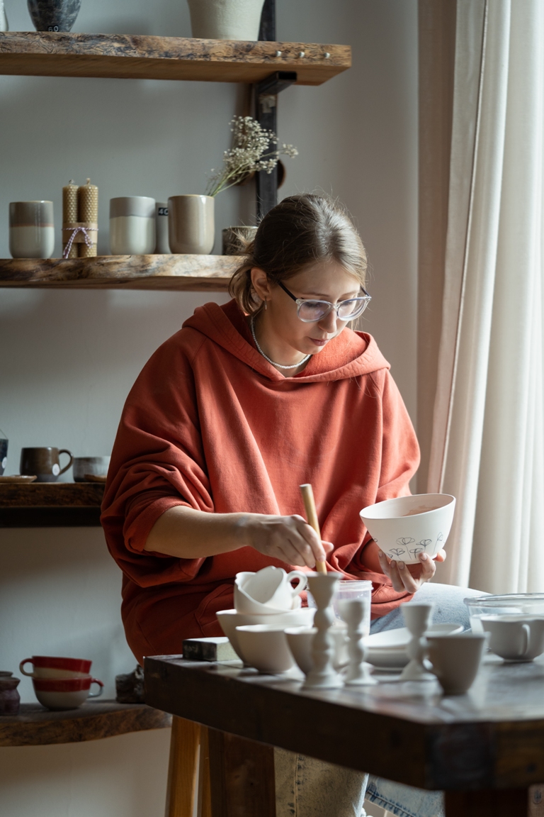 focused artisan girl works on manufacture of clay 2023 03 15 01 46 33 utc