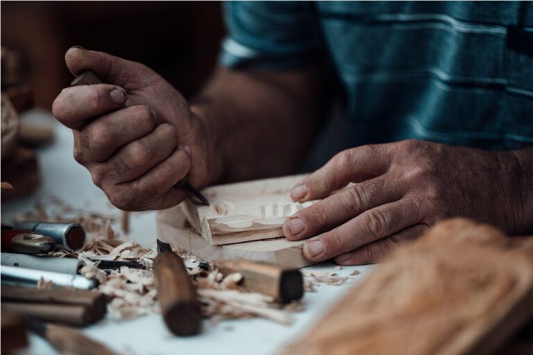 hands of a man carving wood close up 2022 11 15 13 46 00 utc