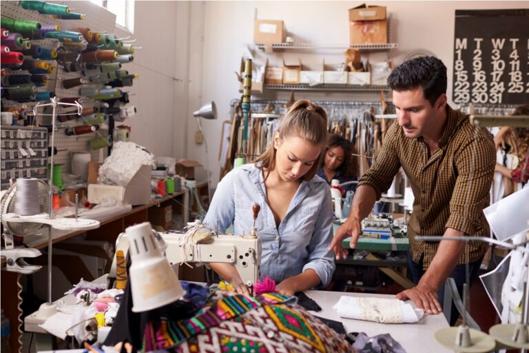manager training machinist at a clothing design studio