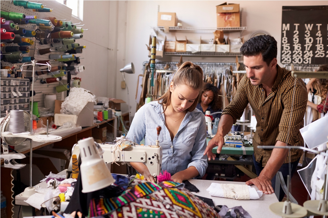 manager training machinist at a clothing design studio