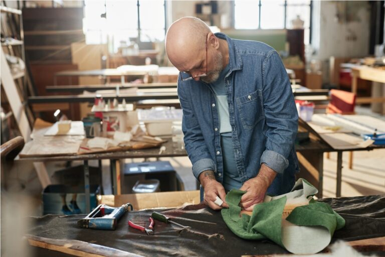senior craftsman refurbishing furniture in worksho 2023 09 07 22 30 05 utc