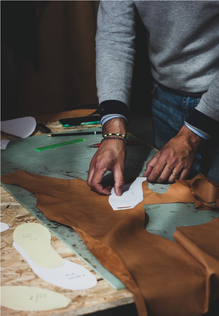 shoe designer working with leather.