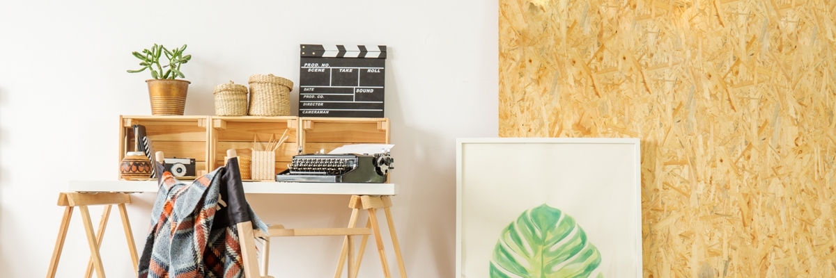 simple home office with desk, chair, and osb wall, panorama