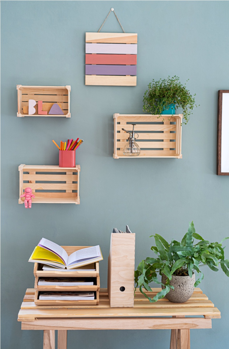 wooden box shelves with decorations on the wall, a natural decor concept.