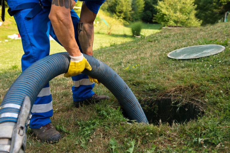emptying household septic tank. cleaning sludge from septic system.